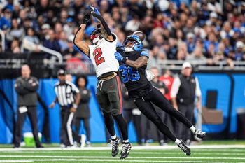 Detroit Lions cornerback Nick Whiteside (38) tackles Tampa Bay Buccaneers wide receiver Emeka Egbuka (2) during the second half at Ford Field in Detroit on Monday, Oct. 20, 2025.