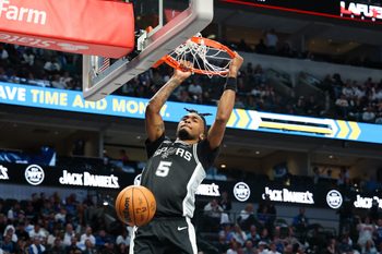 Oct 22, 2025; Dallas, Texas, USA;   San Antonio Spurs guard Stephon Castle (5) dunks against the Dallas Mavericks during the second half at American Airlines Center. Mandatory Credit: Kevin Jairaj-Imagn Images