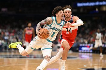 Oct 26, 2025; Washington, District of Columbia, USA; Charlotte Hornets guard LaMelo Ball (1) dribbles past Washington Wizards forward Corey Kispert (24) during the third quarter at Capital One Arena. Mandatory Credit: Rafael Suanes-Imagn Images