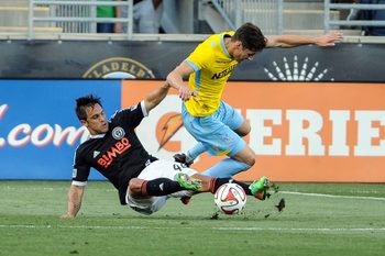 Jul 25, 2014; Chester, PA, USA; Philadelphia Union defender/midfielder Danny Cruz (44) collides with Crystal Palace defender Joel Ward (2) during the first half of the match at PPL Park. Mandatory Credit: John Geliebter-Imagn Images