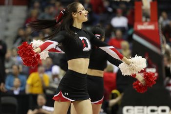 Mar 10, 2018; Washington, DC, USA; A Davidson Wildcats cheerleader dances on the court during a timeout against the St. Bonaventure Bonnies in the second half of an Atlantic 10 conference tournament semifinal at Capital One Arena. The Wildcats won 82-70. Mandatory Credit: Geoff Burke-Imagn Images