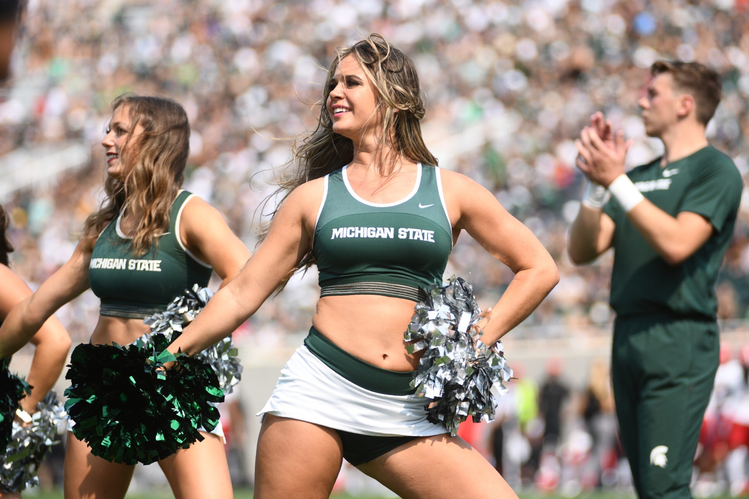 Sep 11, 2021; East Lansing, Michigan, USA; Michigan State Spartans cheerleaders perform during the third quarter against the Youngstown State Penguins at Spartan Stadium. Mandatory Credit: Tim Fuller-Imagn Images