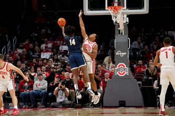 Nov 10, 2022; Columbus, OH, USA;  Ohio State Buckeyes guard Zed Key (23) defends Charleston Southern Buccaneers forward Taje' Kelly (14) during the first half of the NCAA men's basketball game at Value City Arena. Mandatory Credit: Adam Cairns-The Columbus Dispatch

Charleston Southern At Ohio State Men S Basketball