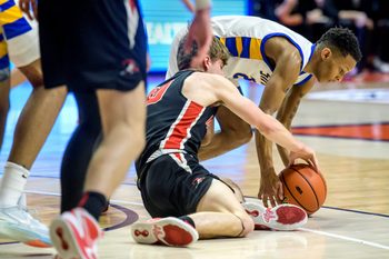 Chicago Simeon's Jalen Griffith and Metamora's Tyler Mason struggle for a loose ball in the first half of the Class 3A basketball state title game Saturday, March 11, 2023 at State Farm Center in Champaign. The Redbirds took the title 46-42.