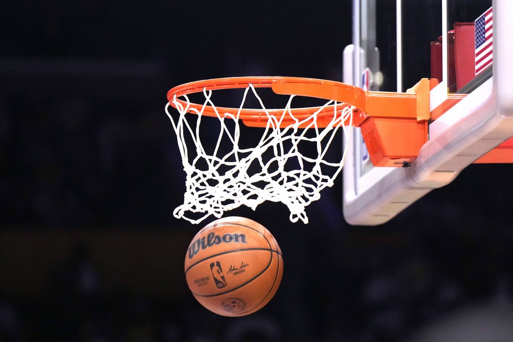 Apr 22, 2023; Los Angeles, California, USA; A Wilson official NBA basketball swishes through the net during game three of the 2023 NBA playoffs between the Los Angeles Lakers and the Memphis Grizzlies at Crypto.com Arena. Mandatory Credit: Kirby Lee-Imagn Images