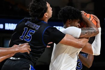 Vanderbilt forward Colin Smith (1) protects the ball from Presbyterian forward Jonah Pierce (15) during the second half of an NCAA college basketball game Tuesday, Nov. 7, 2023, in Nashville, Tenn. Vanderbilt lost 68-62.