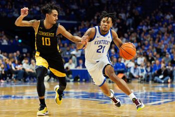Nov 10, 2023; Lexington, Kentucky, USA; Kentucky Wildcats guard D.J. Wagner (21) drives to the basket against Texas A&M Commerce Lions guard Alonzo Dodd (10) during the second half at Rupp Arena at Central Bank Center. Mandatory Credit: Jordan Prather-Imagn Images