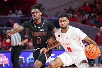 Dec 21, 2023; Houston, Texas, USA;  Houston Cougars guard Mylik Wilson (8) dribbles against Texas State Bobcats guard Dontae Horne (2) in the second half at Fertitta Center. Mandatory Credit: Thomas Shea-Imagn Images