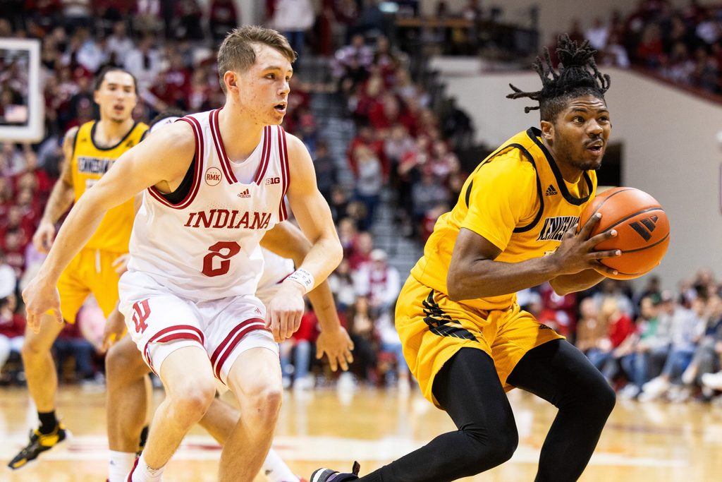 Dec 29, 2023; Bloomington, Indiana, USA; Kennesaw State Owls guard Terrell Burden (1) shoots the ball while Indiana Hoosiers guard Gabe Cupps (2) defends in the second half at Simon Skjodt Assembly Hall. Mandatory Credit: Trevor Ruszkowski-Imagn Images