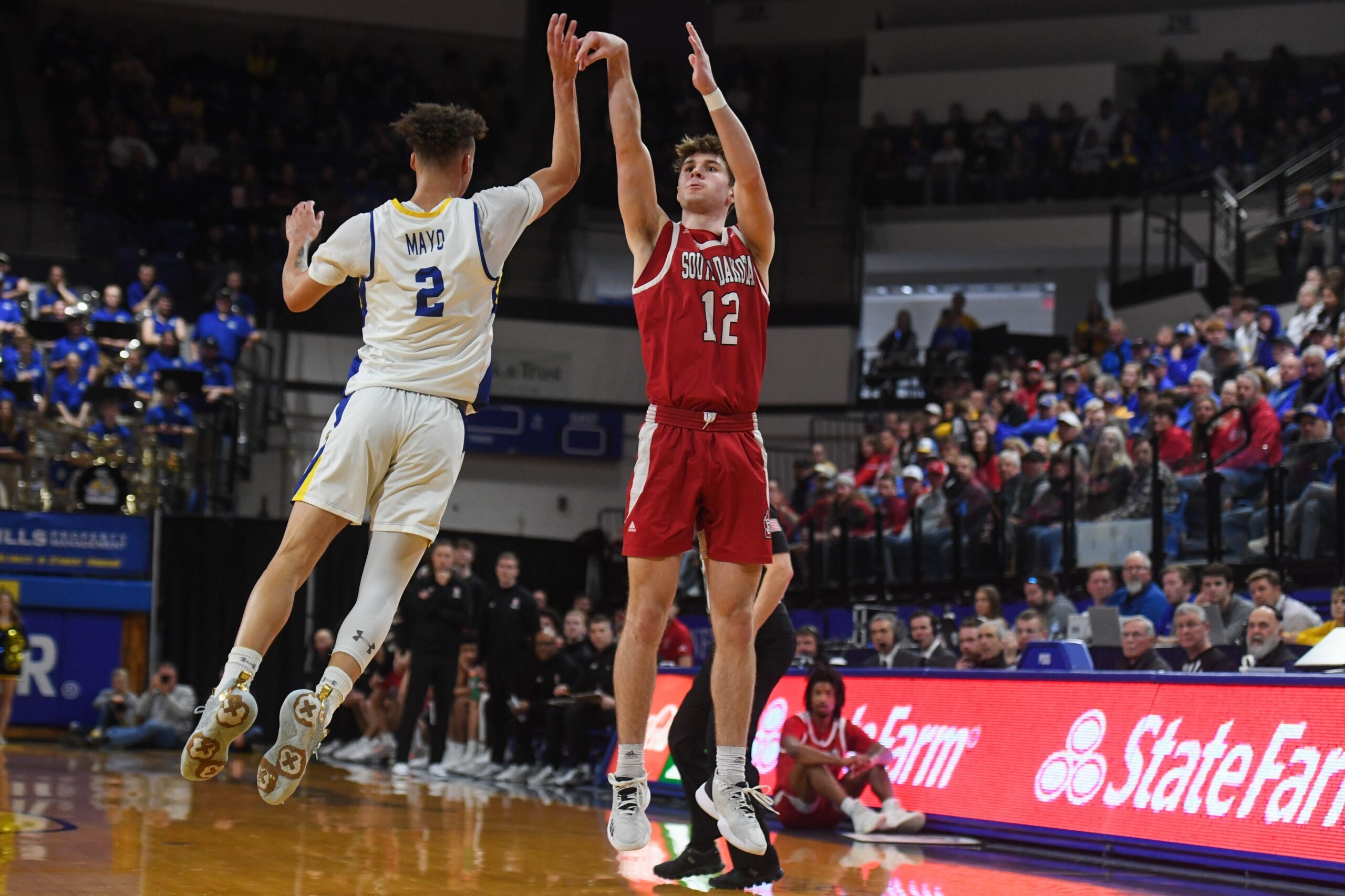 USD guard Isaac Bruns (12) shoots the ball on Sunday, Feb. 4, 2024 at Frost Arena in Brookings.