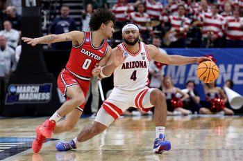 Mar 23, 2024; Salt Lake City, UT, USA; Arizona Wildcats guard Kylan Boswell (4) dribbles against Dayton Flyers guard Javon Bennett (0) during the first half in the second round of the 2024 NCAA Tournament at Vivint Smart Home Arena-Delta Center. Mandatory Credit: Rob Gray-Imagn Images