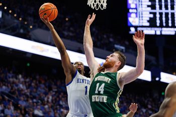 Nov 4, 2024; Lexington, Kentucky, USA; Kentucky Wildcats guard Lamont Butler (1) goes to the basket against Wright State Raiders forward Brandon Noel (14) during the second half at Rupp Arena at Central Bank Center. Mandatory Credit: Jordan Prather-Imagn Images