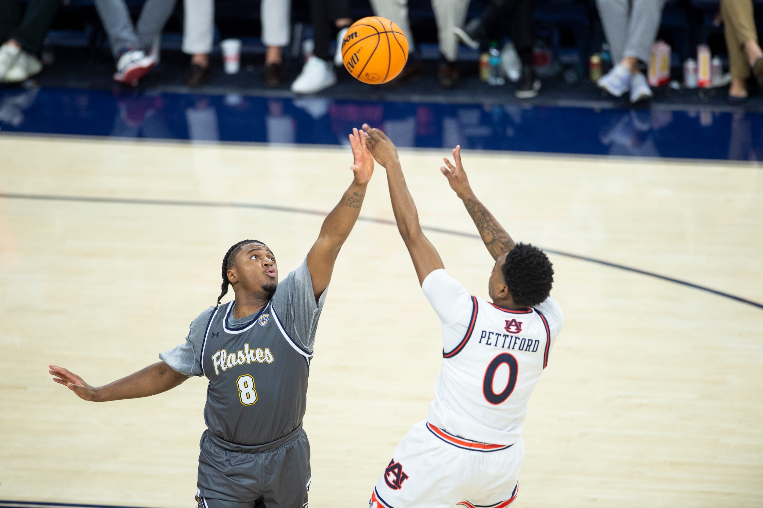 Auburn Tigers guard Tahaad Pettiford (0) shoots over Kent State Golden Flashes guard Morgan Safford (8) as Auburn Tigers take on Kent State Golden Flashes at Neville Arena in Auburn, Ala., on Saturday, Nov. 13, 2024. Auburn Tigers defeated Kent State Golden Flashes 79-56.