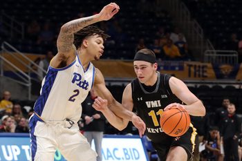 Nov 18, 2024; Pittsburgh, Pennsylvania, USA;  Virginia Military Keydets forward Augustinas Kiudulas (11) goes to the basket against Pittsburgh Panthers forward Cameron Corhen (2) during the first half at the Petersen Events Center. Mandatory Credit: Charles LeClaire-Imagn Images