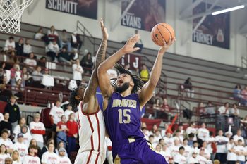 Dec 7, 2024; Norman, Oklahoma, USA; Alcorn State Braves forward Djahi Binet (15) goes to the basket as Oklahoma Sooners forward Jalon Moore (14) defends during the second half at Lloyd Noble Center. Mandatory Credit: Alonzo Adams-Imagn Images