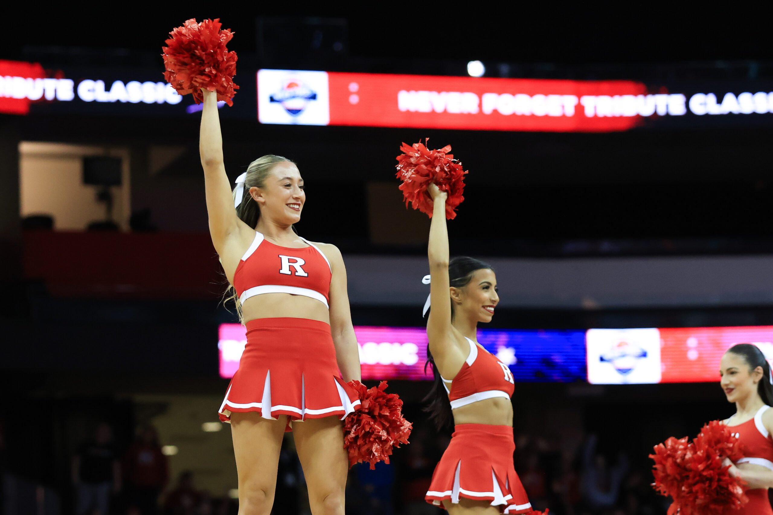 Dec 21, 2024; Newark, New Jersey, USA; Rutgers Scarlet Knights cheerleaders perform during a timeout during the second half between Rutgers Scarlet Knights and Princeton Tigers at Prudential Center. Mandatory Credit: Tom Horak-Imagn Images