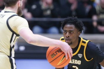 Toledo Rockets guard Sonny Wilson (3) defends Purdue Boilermakers guard Braden Smith (3) Sunday, Dec. 29, 2024, during the NCAA men’s basketball game at Mackey Arena in West Lafayette, Ind.