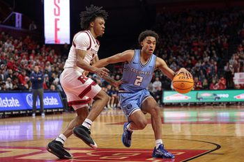 Dec 30, 2024; Piscataway, New Jersey, USA; Columbia Lions guard Kenny Noland (2) is guarded by Rutgers Scarlet Knights guard Jamichael Davis (1) during the first half at Jersey Mike's Arena. Mandatory Credit: Vincent Carchietta-Imagn Images