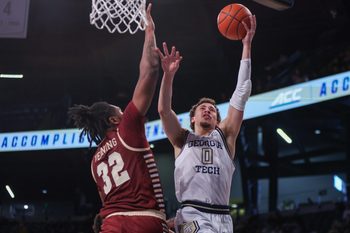 Jan 4, 2025; Atlanta, Georgia, USA; Georgia Tech Yellow Jackets guard Lance Terry (0) shoots past Boston College Eagles forward Chad Venning (32) in the second half at McCamish Pavilion. Mandatory Credit: Brett Davis-Imagn Images