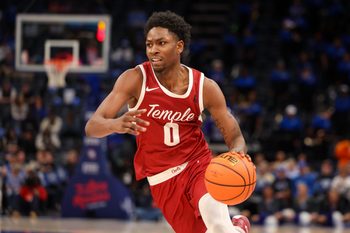 Feb 9, 2025; Memphis, Tennessee, USA; Temple Owls guard Quante Berry (0) drives to the basket against the Memphis Tigers during the second half at FedExForum. Mandatory Credit: Wesley Hale-Imagn Images