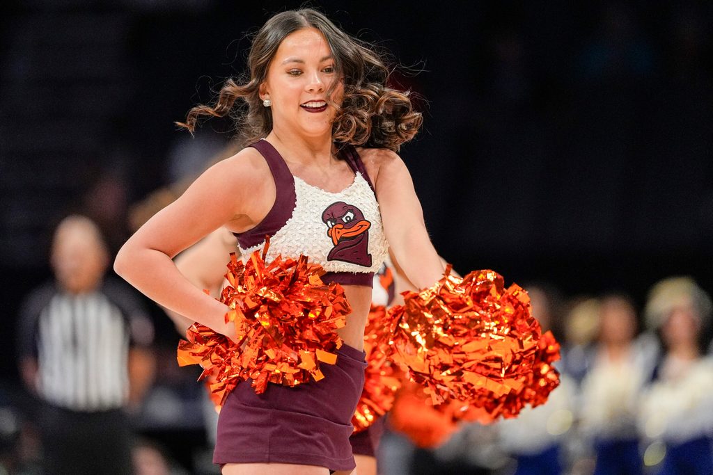 Mar 11, 2025; Charlotte, NC, USA; Virginia Tech Hokies cheerleaders during the first half against the California Golden Bears at Spectrum Center. Mandatory Credit: Jim Dedmon-Imagn Images