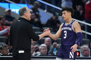 Mar 13, 2025; Indianapolis, IN, USA; Northwestern Wildcats head coach Chris Collins greets Northwestern Wildcats guard Ty Berry (3) as he checks out of the game during the second half against the Wisconsin Badgers at Gainbridge Fieldhouse. Mandatory Credit: Robert Goddin-Imagn Images