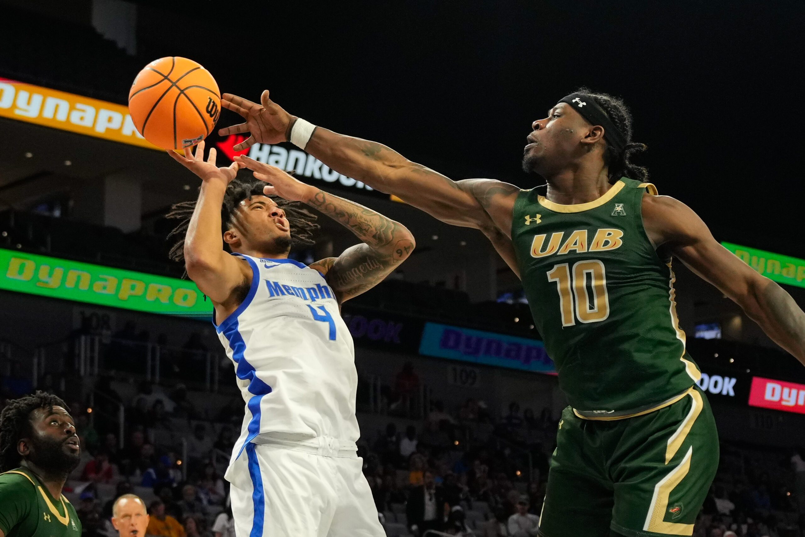 Mar 16, 2025; Fort Worth, TX, USA;  Memphis Tigers guard PJ Haggerty (4) has his shot bloked by UAB Blazers guard Alejandro Vasquez (10) during the second half at Dickies Arena. Mandatory Credit: Chris Jones-Imagn Images