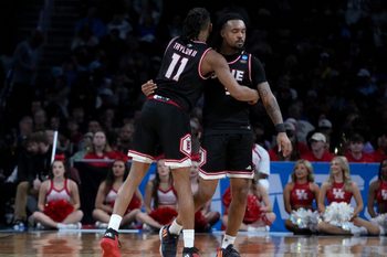 Mar 20, 2025; Wichita, KS, USA; SIU Edwardsville Cougars guard Brian Taylor II (11) and guard Ray'Sean Taylor (3) react in the second half of a first round men’s NCAA Tournament game against the Houston Cougars at Intrust Bank Arena. Mandatory Credit: Kirby Lee-Imagn Images