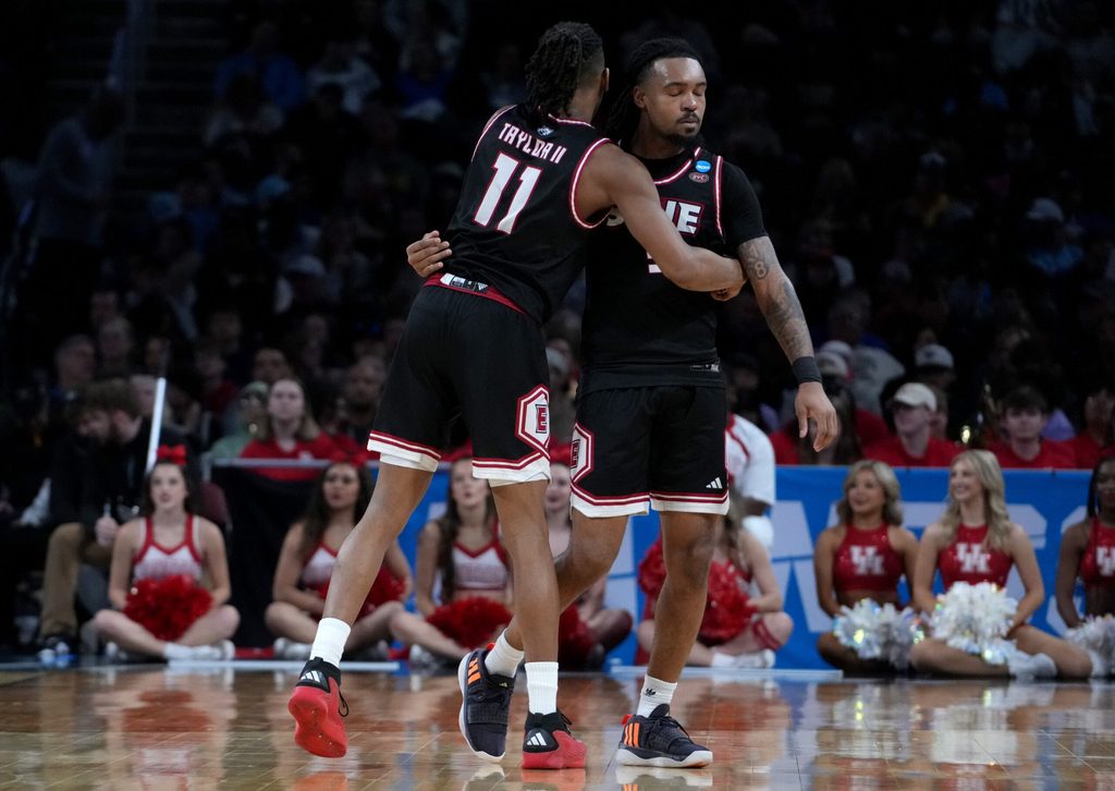 Mar 20, 2025; Wichita, KS, USA; SIU Edwardsville Cougars guard Brian Taylor II (11) and guard Ray'Sean Taylor (3) react in the second half of a first round men’s NCAA Tournament game against the Houston Cougars at Intrust Bank Arena. Mandatory Credit: Kirby Lee-Imagn Images
