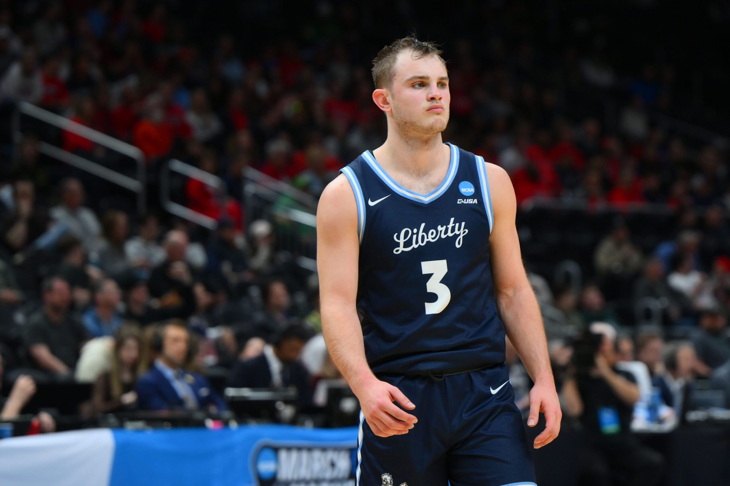 Mar 21, 2025; Seattle, WA, USA; Liberty Flames guard Kaden Metheny (3) reacts during the second half in the first round of the NCAA Tournament at Climate Pledge Arena. Mandatory Credit: Steven Bisig-Imagn Images