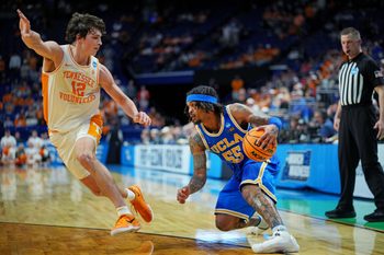 Mar 22, 2025; Lexington, KY, USA; UCLA Bruins guard Skyy Clark (55) handles the ball against Tennessee Volunteers forward Cade Phillips (12) during the second half in the second round of the NCAA Tournament at Rupp Arena. Mandatory Credit: Aaron Doster-Imagn Images