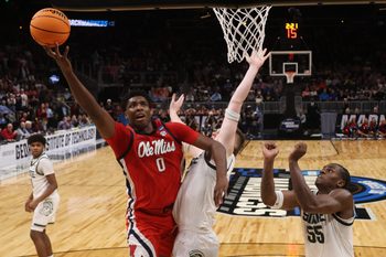 Mar 28, 2025; Atlanta, GA, USA; Mississippi Rebels forward Malik Dia (0) shoots against Michigan State Spartans forward Jaxon Kohler (0) in the first half of a South Regional semifinal of the 2025 NCAA tournament at State Farm Arena. Mandatory Credit: Brett Davis-Imagn Images