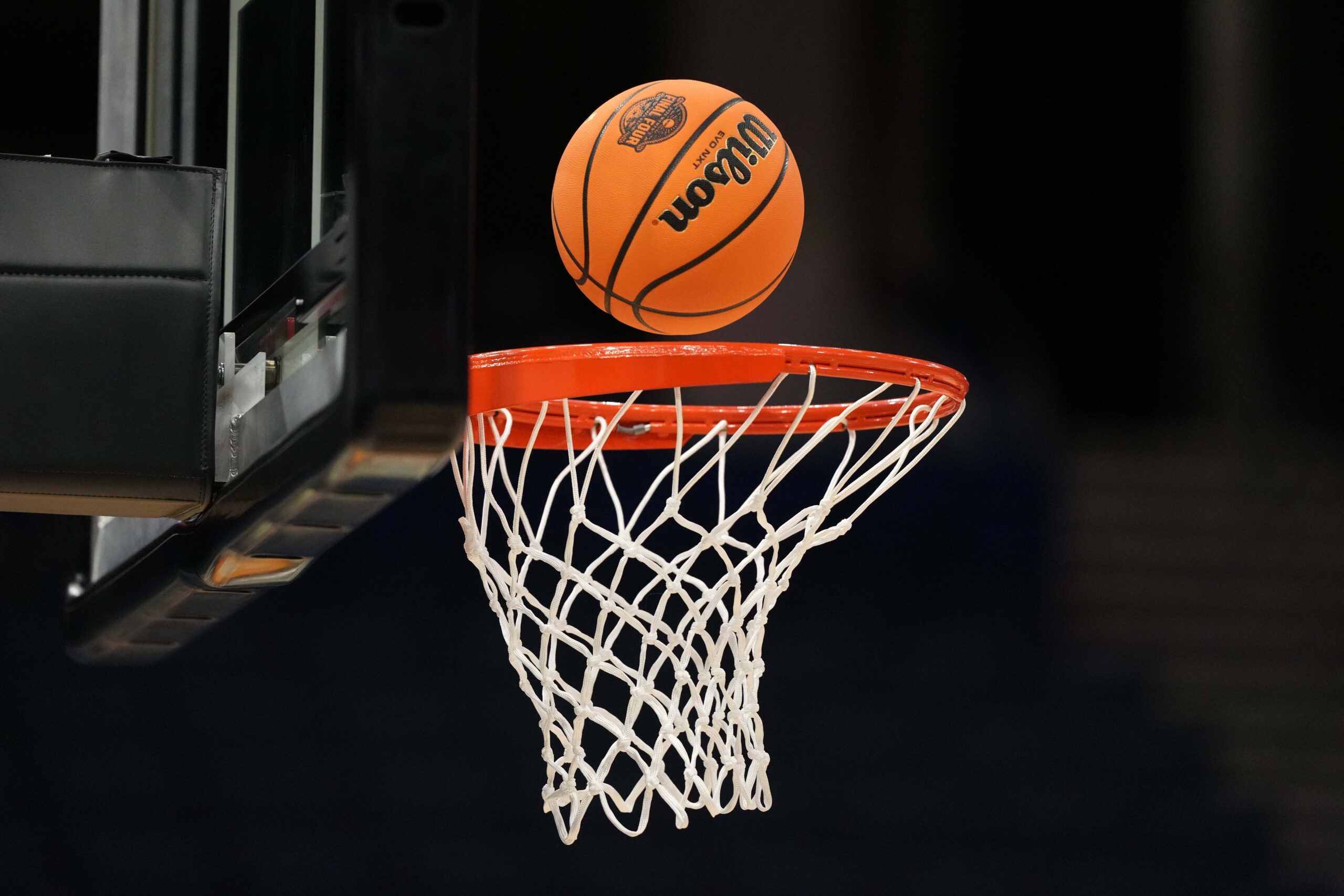 Apr 3, 2025; Tampa, FL, USA; A Wilson EVO Nxt basketball ball with the 2025 NCAA Women's Final Four logo approaches the rim and the net at Amalie Arena. Mandatory Credit: Kirby Lee-Imagn Images