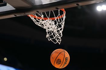 Apr 3, 2025; Tampa, FL, USA; A Wilson EVO Nxt basketball ball with the 2025 NCAA Women's Final Four logo approaches the rim and the net at Amalie Arena. Mandatory Credit: Kirby Lee-Imagn Images