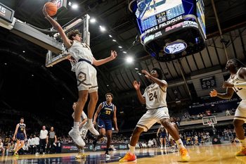 UC Irvine Anteaters forward Kyle Evans (14) throws the ball back in bounds to UC Irvine Anteaters guard Jurian Dixon (24) on Thursday, April 3, 2025, during the National Invitational Tournament at Hinkle Fieldhouse in Indianapolis.