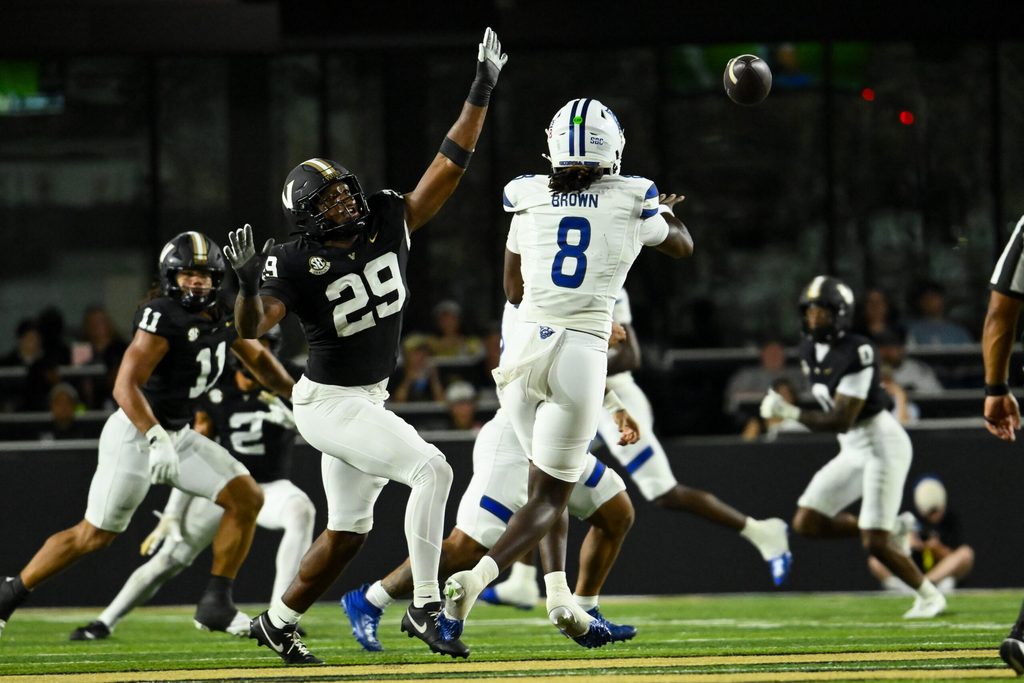 Sep 20, 2025; Nashville, Tennessee, USA; Vanderbilt Commodores edge Miles Capers (29) flushes Georgia State Panthers quarterback Cameran Brown (8) from the pocket during the first half at FirstBank Stadium. Mandatory Credit: Steve Roberts-Imagn Images
