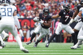 Sep 28, 2025; Houston, Texas, USA; Houston Texans running back Nick Chubb (21) runs with the ball during the fourth quarter against the Tennessee Titans at NRG Stadium. Mandatory Credit: Troy Taormina-Imagn Images