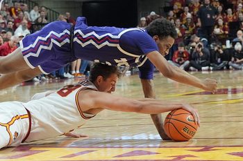Iowa State Cyclones forward Brandton Chatfield, bottom, and TCU Horned Frogs guard Vasean Allette battle for a loose ball during a Big 12 men’s basketball game at Hilton Coliseum on Feb 8, 2025 in Ames, Iowa.