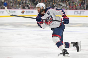 Oct 11, 2025; Saint Paul, Minnesota, USA;  Columbus Blue Jackets forward Kirill Marchenko (86) completes the hat trick against the Minnesota Wild on this power play goal during the third period at Grand Casino Arena. Mandatory Credit: Nick Wosika-Imagn Images