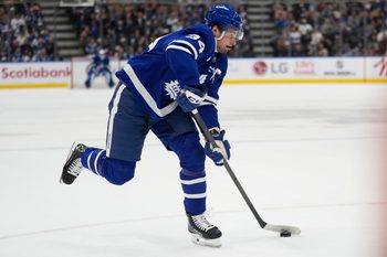 Oct 21, 2025; Toronto, Ontario, CAN; Toronto Maple Leafs forward Auston Matthews (34) shoots against the New Jersey Devils during the first period at Scotiabank Arena. Mandatory Credit: John E. Sokolowski-Imagn Images