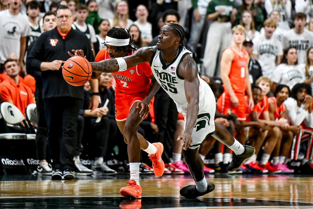 Michigan State's Coen Carr, right, and Bowling Green's Javontae Campbell go after a ball after Carr blocks Campbell's shot during the second half on Thursday, Oct. 23, 2025, at the Breslin Center in East Lansing.
