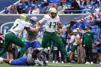 Oct 25, 2025; Memphis, Tennessee, USA; South Florida Bulls quarterback Byrum Brown (17) runs with the ball against the Memphis Tigers during the second half at Simmons Bank Liberty Stadium. Mandatory Credit: Wesley Hale-Imagn Images
