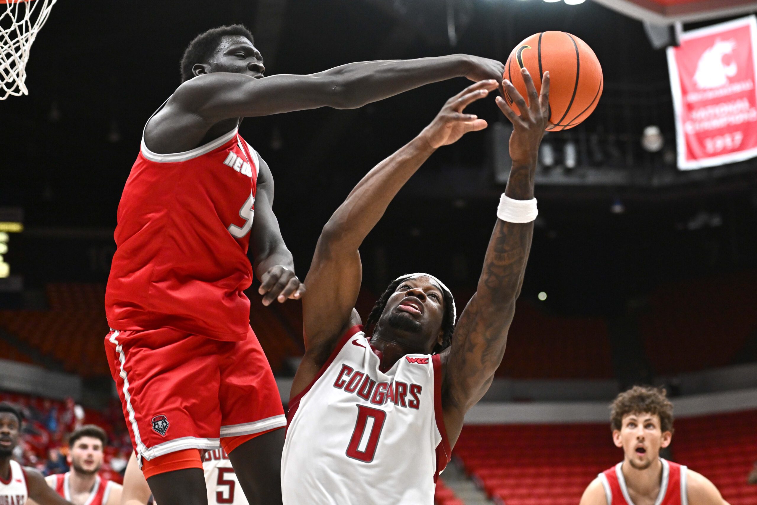 Oct 25, 2025; Pullman, WA, USA; New Mexico Lobos forward Antonio Chol (5) fights for the rebound against Washington State Cougars forward Emmanuel Ugbo (0) in the second half at Friel Court at Beasley Coliseum.  Mandatory Credit: James Snook-Imagn Images