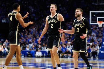Oct 24, 2025; Lexington, KY, USA; Purdue Boilermakers guard Fletcher Loyer (2), guard Braden Smith (3) and forward Trey Kaufman-Renn (4) huddle up during the first half against the Kentucky Wildcats at Rupp Arena at Central Bank Center. Mandatory Credit: Jordan Prather-Imagn Images