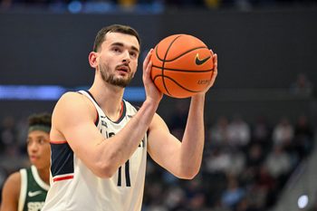Oct 28, 2025; Hartford, CT, USA; Connecticut Huskies forward Alex Karaban (11) shoot a free throw during the first half against the Michigan State Spartans at PeoplesBank Arena. Mandatory Credit: Mark Smith-Imagn Images