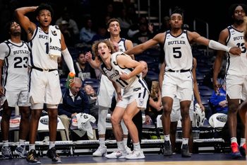 Butler Bulldogs guard Evan Haywood (1), Butler Bulldogs guard Finley Bizjack (11) and Butler Bulldogs forward Michael Ajayi (5) watch from the sidelines on Wednesday, Oct. 29, 2025, during the game at Hinkle Fieldhouse in Indianapolis. The Butler Bulldogs defeated the Indiana State Sycamores, 105-80.