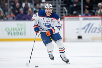 Oct 25, 2025; Seattle, Washington, USA; Edmonton Oilers forward Connor McDavid (97) skates with the puck against the Seattle Kraken at Climate Pledge Arena. Mandatory Credit: Stephen Brashear-Imagn Images