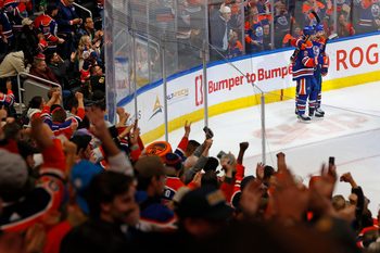 Nov 1, 2025; Edmonton, Alberta, CAN; The Edmonton Oilers celebrate a goal scored by defensemen Evan Bouchard (2) during overtime against the Chicago Blackhawks at Rogers Place. Mandatory Credit: Perry Nelson-Imagn Images