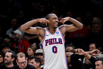 Nov 2, 2025; Brooklyn, New York, USA; Philadelphia 76ers guard Tyrese Maxey (0) flexes his muscles from the bench during the second half against the Brooklyn Nets at Barclays Center. Mandatory Credit: John Jones-Imagn Images