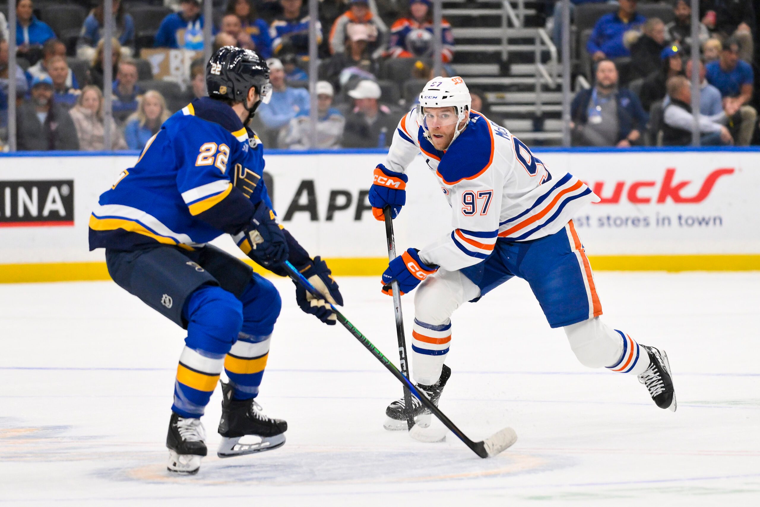 Nov 3, 2025; St. Louis, Missouri, USA; Edmonton Oilers center Connor McDavid (97) controls the puck as St. Louis Blues center Pius Suter (22) defends during the first period at Enterprise Center. Mandatory Credit: Jeff Curry-Imagn Images